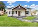 Charming home with a covered front porch, well-maintained lawn, and traditional architectural details at 703 Rankin Ave, Mount Holly, NC 28120