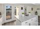 Kitchen island with granite countertops and stainless steel hardware opens to backyard patio at 703 Rankin Ave, Mount Holly, NC 28120
