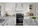 Updated kitchen boasts granite countertops, subway tile backsplash and stainless-steel appliances at 703 Rankin Ave, Mount Holly, NC 28120