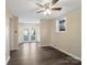 A flexible space includes a ceiling fan and backyard access through glass patio doors and a window for natural light at 703 Rankin Ave, Mount Holly, NC 28120