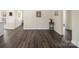 Open living room with hardwood flooring and neutral paint providing an inviting atmosphere at 703 Rankin Ave, Mount Holly, NC 28120
