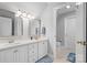 Bright bathroom features a double vanity, framed mirrors and neutral tile flooring at 71 40Th Avenue Ne Dr # 7, Hickory, NC 28601