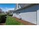 Side view of a home with vinyl siding, neat landscaping, and satellite dish at 71 40Th Avenue Ne Dr # 7, Hickory, NC 28601