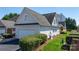 Exterior view of a home showcasing the side-entry garage and manicured landscaping at 71 40Th Avenue Ne Dr # 7, Hickory, NC 28601