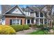 Beautiful home exterior showcasing a blend of brick and siding with manicured landscaping at 71 40Th Avenue Ne Dr # 7, Hickory, NC 28601