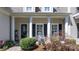 Welcoming entrance with white columns, seasonal decor, and well-maintained landscaping at 71 40Th Avenue Ne Dr # 7, Hickory, NC 28601