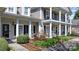 Inviting front porch with rocking chairs, lush landscaping, and charming curb appeal at 71 40Th Avenue Ne Dr # 7, Hickory, NC 28601