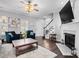Inviting living room featuring a fireplace, a ceiling fan, and stylish decor with neutral wall colors at 71 40Th Avenue Ne Dr # 7, Hickory, NC 28601