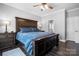 Comfortable main bedroom featuring a dark wood floor and view into the Primary bathroom at 71 40Th Avenue Ne Dr # 7, Hickory, NC 28601
