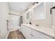 Well-lit bathroom showcasing a double sink vanity with granite countertops and modern fixtures at 7419 Tesh Rd, Monroe, NC 28110