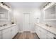 Bathroom boasts dual sinks and vanities with modern countertops at 7419 Tesh Rd, Monroe, NC 28110