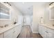 Bathroom features dual sinks, modern vanities, and a view of the shower at 7419 Tesh Rd, Monroe, NC 28110