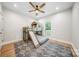 Bright bedroom featuring a unique bunk bed with a slide and a cozy playhouse design at 7419 Tesh Rd, Monroe, NC 28110
