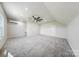 Spacious bonus room with neutral carpet, recessed lighting, and ceiling fan at 7419 Tesh Rd, Monroe, NC 28110
