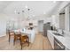 Modern kitchen with white cabinetry, an island, stainless steel appliances, and bright natural light at 7419 Tesh Rd, Monroe, NC 28110