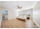Bright bedroom with hardwood floors, ensuite bathroom, and large windows at 7419 Tesh Rd, Monroe, NC 28110