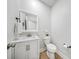 Small powder room with hard wood floors and a modern sink at 7419 Tesh Rd, Monroe, NC 28110