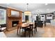 A dining room with a fireplace and a view of a kitchen island at 801 Glendora Dr, Charlotte, NC 28212