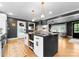 Bright, open kitchen featuring modern island, stainless appliances, and ample counter space for cooking at 801 Glendora Dr, Charlotte, NC 28212