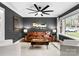 Cozy living room showcasing modern decor, including stylish furniture, unique artwork, and a ceiling fan at 801 Glendora Dr, Charlotte, NC 28212