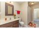 Comfortable bathroom with vanity, tile floor, tub, and decorative accents at 8033 Charter Oak Ln, Charlotte, NC 28226