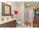 Comfortable bathroom with vanity, tile floor, tub, and decorative accents at 8033 Charter Oak Ln, Charlotte, NC 28226