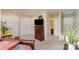 Cozy bedroom featuring soft carpet, closet, and a dresser with mounted TV at 8033 Charter Oak Ln, Charlotte, NC 28226