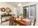 Dining room features a wood table, place settings, and a sliding door to the outside patio at 8033 Charter Oak Ln, Charlotte, NC 28226