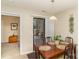 Bright dining area with wood table, a sliding glass door to outdoor space, and simple decor at 8033 Charter Oak Ln, Charlotte, NC 28226