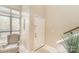 Bright entryway showcases a white front door, neutral walls, a patterned chair and large window at 8033 Charter Oak Ln, Charlotte, NC 28226