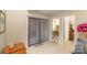 Carpeted living room with sliding glass door access and view into the dining room and kitchen at 8033 Charter Oak Ln, Charlotte, NC 28226