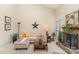 Cozy living room with a fireplace, a comfortable sofa, decor and natural light at 8033 Charter Oak Ln, Charlotte, NC 28226