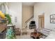Comfortable living room features a brick fireplace, staircase and ample seating at 8033 Charter Oak Ln, Charlotte, NC 28226