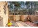Private brick patio with seating, a gate, and a garden, offering a tranquil outdoor space at 8033 Charter Oak Ln, Charlotte, NC 28226