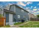 A shot of the back of this lovely two-story home with nice lawn and patio area and privacy fencing at 8125 Sheringham Way, Charlotte, NC 28227