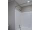 Bathroom shower and tub combo with white tile and gray walls at 8125 Sheringham Way, Charlotte, NC 28227
