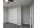 Cozy bedroom features gray carpet, ceiling fan, closet, and neutral paint at 8125 Sheringham Way, Charlotte, NC 28227
