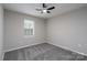 Neutral bedroom with gray carpet, one window and neutral paint at 8125 Sheringham Way, Charlotte, NC 28227