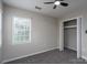 Bedroom with a window, closet and a ceiling fan at 8125 Sheringham Way, Charlotte, NC 28227