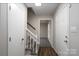 Inviting entryway with hardwood floors, a staircase, and freshly painted walls at 8125 Sheringham Way, Charlotte, NC 28227