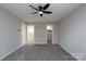 Main bedroom with carpet, ceiling fan and ensuite bathroom at 8125 Sheringham Way, Charlotte, NC 28227