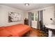 Welcoming bedroom space with hardwood floors, neutral walls, and ample natural light at 842 E Woodlawn Rd, Charlotte, NC 28209