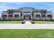 Striking commercial building featuring a landscaped entrance and modern architectural design at 842 E Woodlawn Rd, Charlotte, NC 28209