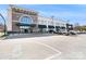 Exterior view of a Whole Foods Market with parking spaces and pedestrian access at 842 E Woodlawn Rd, Charlotte, NC 28209