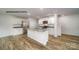 Contemporary kitchen boasts an island, stainless steel appliances, and light cabinets at 890 Two Brothers Ln, York, SC 29745
