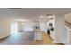 Open-concept living space with wood-look flooring, kitchen, and stainless steel appliances at 890 Two Brothers Ln, York, SC 29745