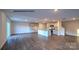 Spacious living area with wood-look floors, kitchen, and staircase, perfect for entertaining at 890 Two Brothers Ln, York, SC 29745