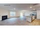 Open layout combines the living room with a fireplace, modern kitchen, and bright dining area at 890 Two Brothers Ln, York, SC 29745