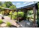 Backyard featuring a deck, lush landscaping, and lake views at 9500 Windygap Rd, Charlotte, NC 28278