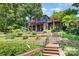 Stunning waterfront home with a beautiful backyard, landscaping, and private dock access at 9500 Windygap Rd, Charlotte, NC 28278